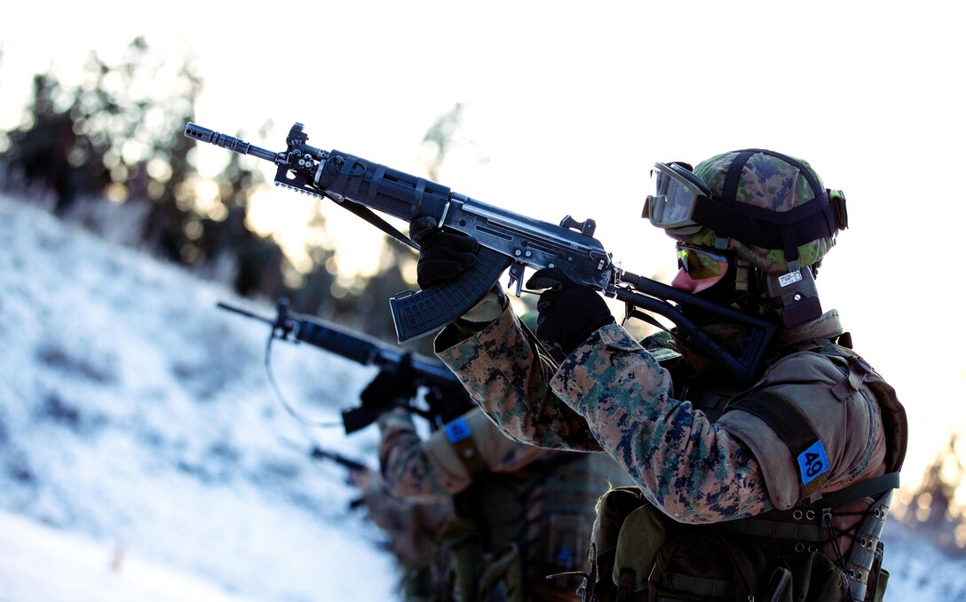 Sergeant James Schmidt, a squad leader with Black Sea Rotational Force 14, engages his target at a range during a Military Operations in Urban Terrain Instructor’s course in Helsinki, Finland, Jan. 15, 2014. The live-fire range served as an introduction to the Finnish Defence Force’s service rifle, the RK 95 TP assault rifle. The training and partnership between the U.S. and Finnish forces proved to be an integral part of BSRF-14’s mission of maintaining and further strengthening close-and-solid relationships while promoting regional stability and increasing interoperability with partner nations in the region.