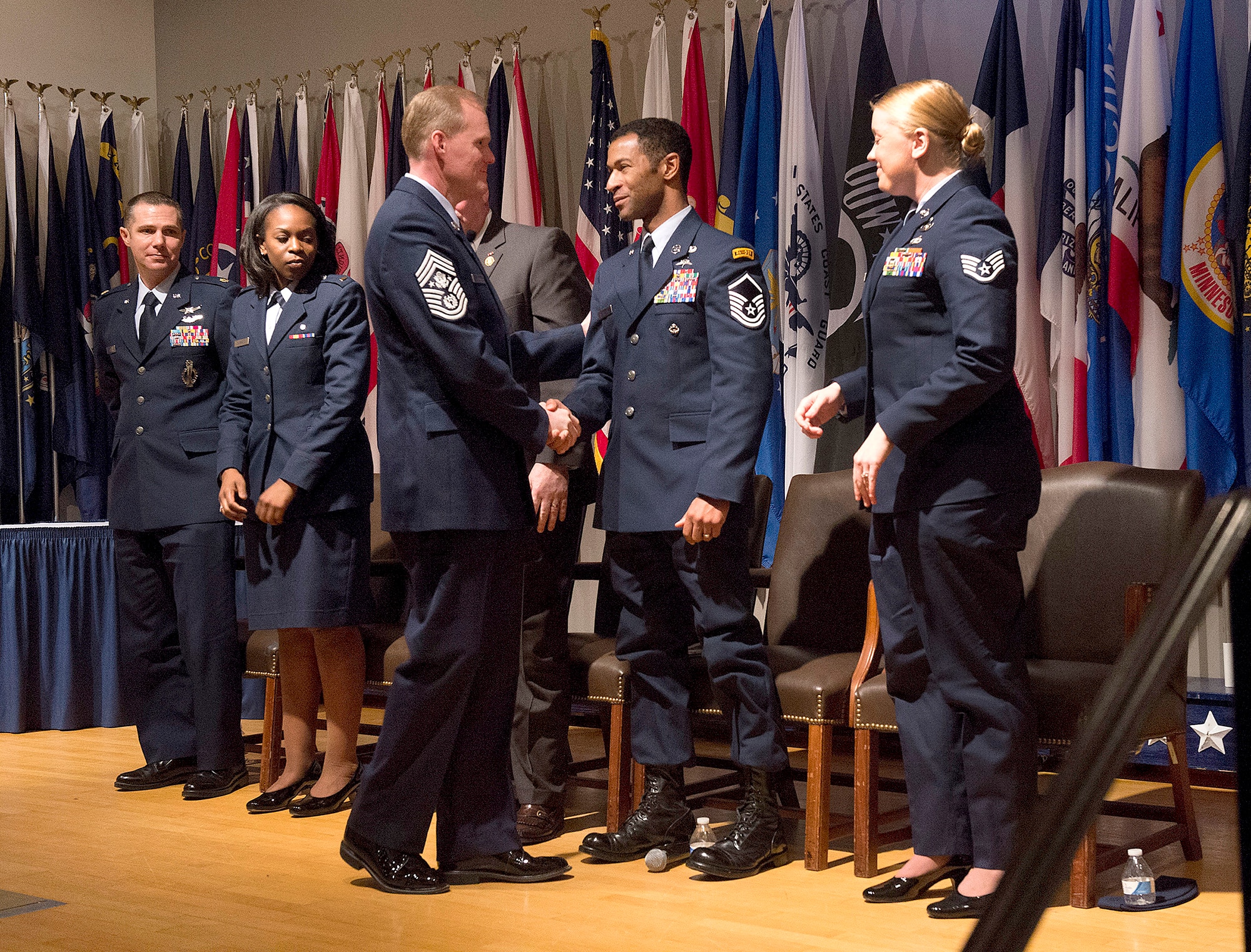 Chief Master Sgt. of the Air Force James A. Cody shakes hands with Airmen selected for Portraits in Courage Feb. 5, 2014, during a recognition ceremony in Arlington, Va.  Portraits in Courage highlights individual Airmen for their honor, valor, devotion and selfless sacrifice in the face of extreme danger to themselves and others.  (U.S. Air Force photo/Jim Varhegyi)