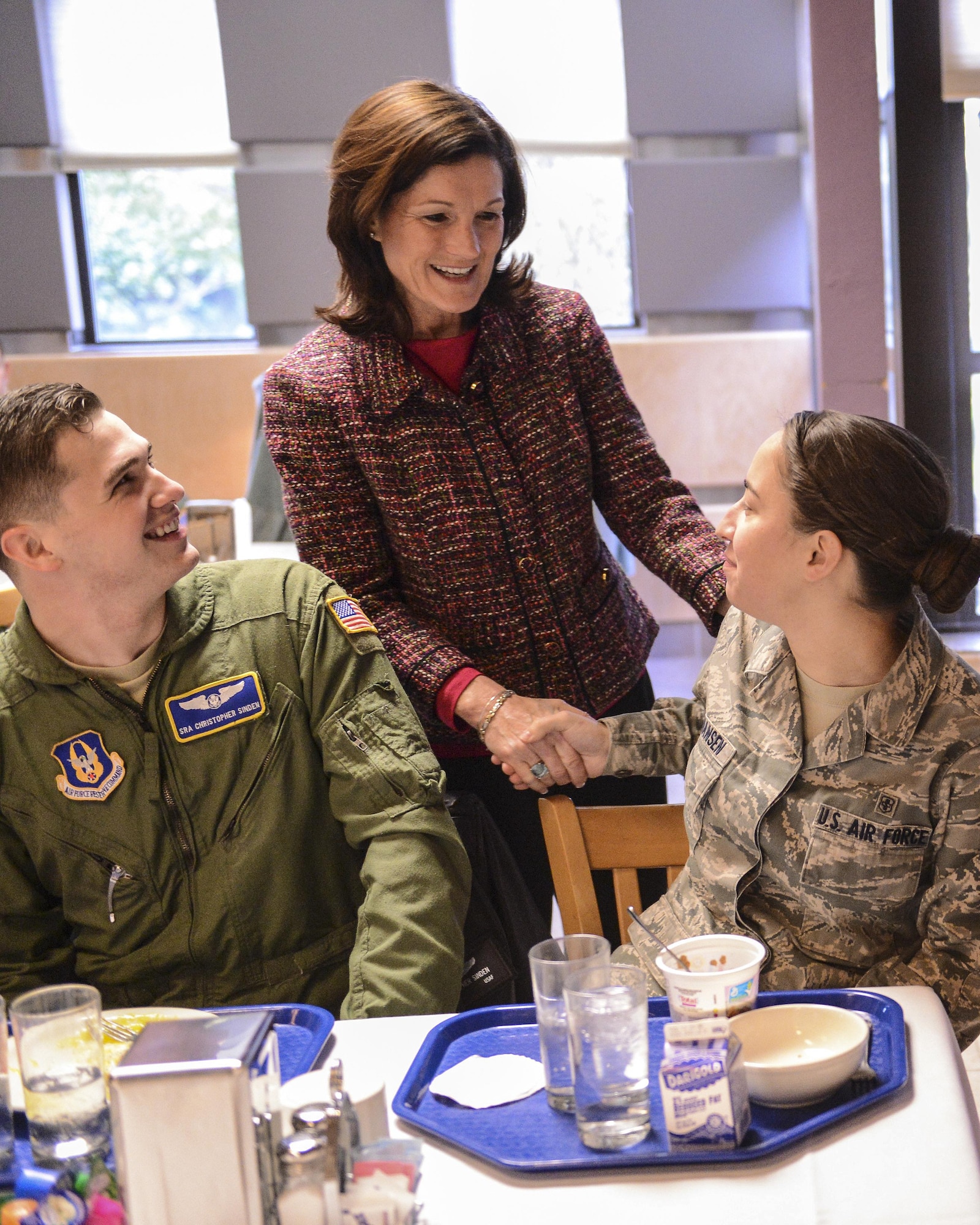 Betty Welsh, wife of Air Force Chief of Staff Gen. Mark A. Welsh III, meets with Senior Airman Christopher Sinden, 313th Airlift Squadron loadmaster, and Senior Airman Erin Johansen, 62nd Medical Squadron aerospace medical technician, Feb. 4, 2014, during an Airmen's breakfast at Joint Base Lewis-McChord, Wash. Gen. and Mrs. Welsh had breakfast with a group of Team McChord Airmen and spouses and answered questions from the members. (U.S. Air Force photo/Tech. Sgt. Sean Tobin)