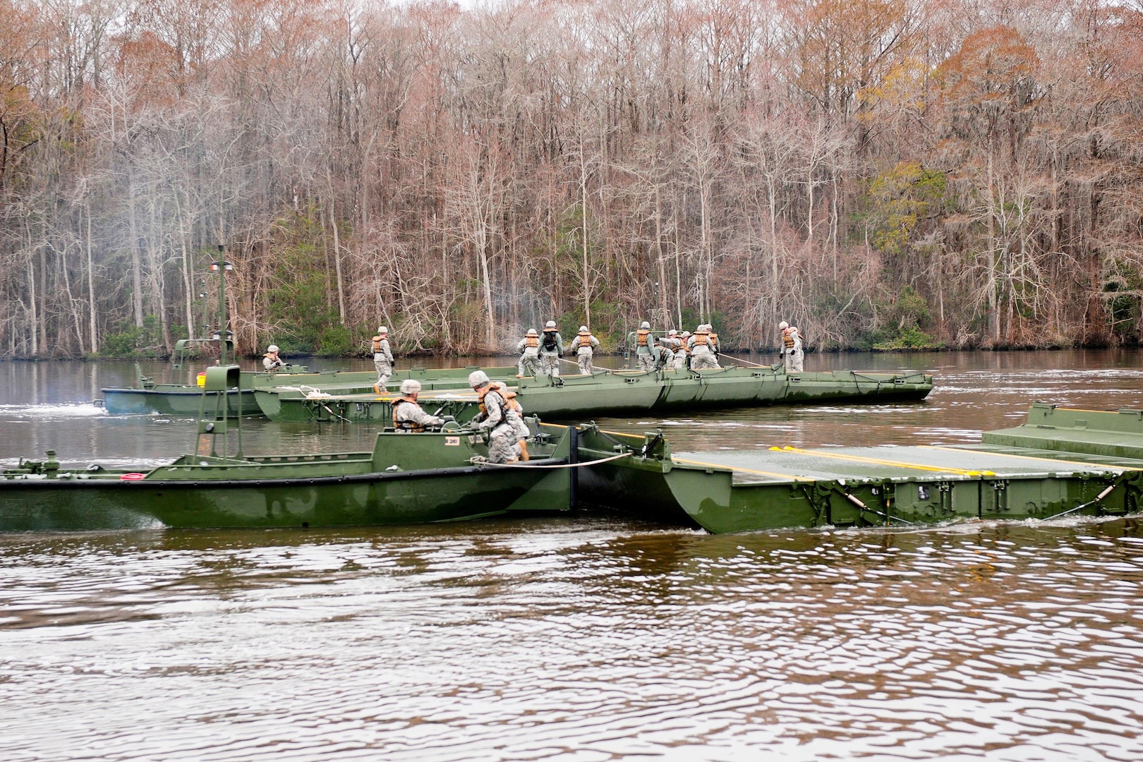 Members of the 125th Multi-Role Bridge Company (MRBC), South Carolina Army National Guard, construct a temporary floating bridge to support "Palmetto Thunder" and Operation Coastal Response, a joint training exercise between local authorities and the National Guard on Feb. 1, 2014, at Murrells Inlet, S.C.