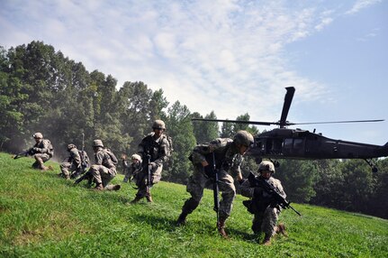 Infantrymen enrolled in the Fort Pickett-based 183rd Regiment, Regional Training Institute's Light Leaders Course conduct their final training exercise June 25, 2013, air assaulting into the Military Operations in Urban Terrain site with help from the Sandston-based 2nd Battalion, 224th Aviation Regiment.