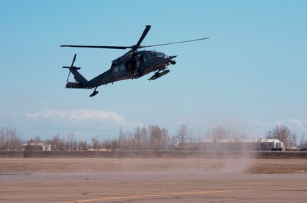 An HH-60 Pave Hawk with the 210th Rescue Squadron, Alaska Air National Guard, lands on the airfield in Galena, Alaska, to assist in the evacuation of residents from Galena, Alaska, May 28, 2013. A similar helicopter rescued an injured snowmachine rider.