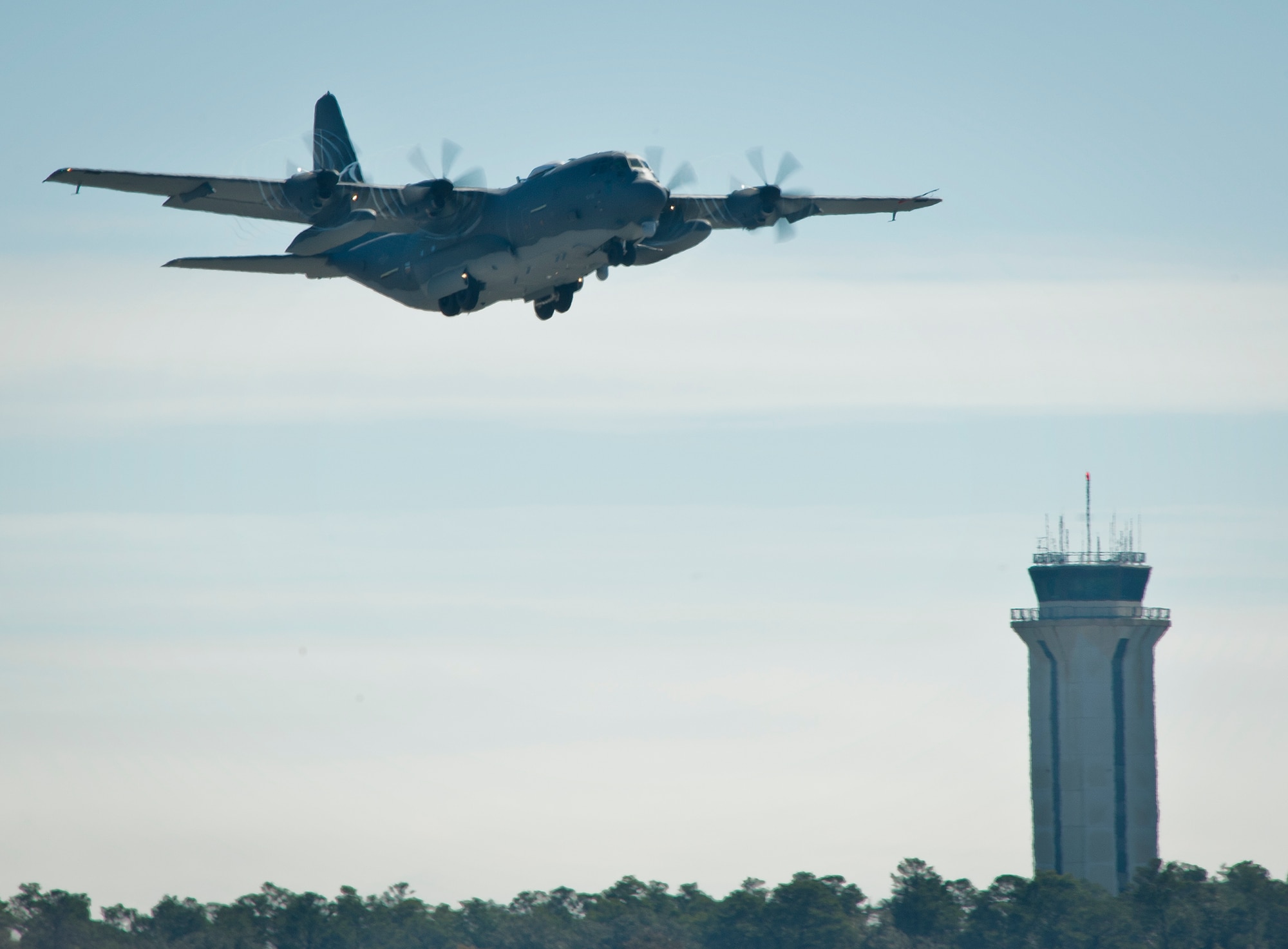 The newly created AC-130J Ghostrider takes to the air during its first official sortie Jan. 31 at Eglin Air Force Base, Fla. The Air Force Special Operations Command MC-130J arrived at Eglin in January 2013 to begin the modification process for the AC-130J, whose primary mission is close air support, air interdiction and armed reconnaissance. A total of 32 MC-130J prototypes will be modified as part of a $2.4 billion AC-130J program to grow the future fleet. (U.S. Air Force photo/Sara Vidoni) 