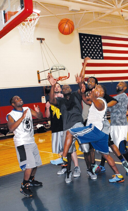 A host of players battle for control of the ball during a recent lunchtime pickup basketball game at Thomason Gymnasium at Marine Corps Logistics Base Albany, recently. 