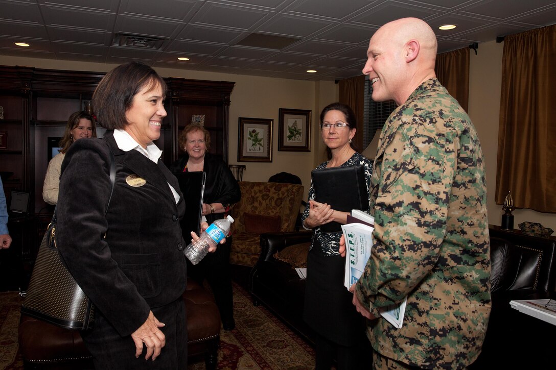 Sgt. Maj. Micheal P. Barrett, the 17th Sergeant Major of the Marine Corps, receives briefs at Marine Corps Base Camp Lejeune, N.C., on Feb. 4, 2014. (U.S. Marine Corps photo by Lance Cpl. Alejandro Sierras)

