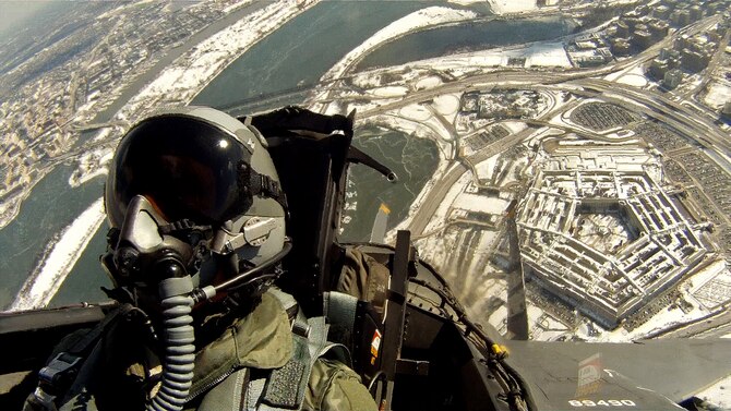 Capt. Philip Gunn participates in a flyover during the internment ceremony of Brig. Gen. Robinson Risner, Jan. 23, 2014, at Arlington National Cemetery, Va. Risner was the Air Force's 20th ace and survived more than seven years of captivity as a prisoner during the Vietnam War. Gunn is a 336th Fighter Squadron weapons system officer assigned to Seymour Johnson Air Force Base, N.C. (Courtesy photo)