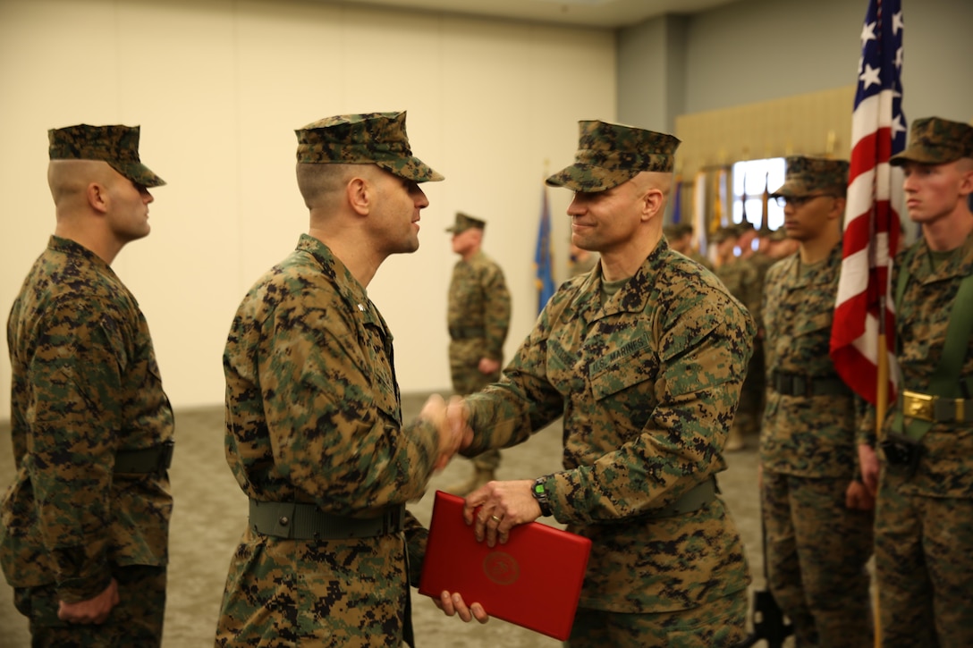 Members of Marine Light Attack Helicopter Squadron 467 stand in formation during a relief and appointment ceremony at Miller’s Landing Feb. 4. Sgt. Maj. Charles A. Metzger relinquished his post to Sgt. Maj. John M. Kennedy after two years as the senior enlisted Marine at HMLA-467.