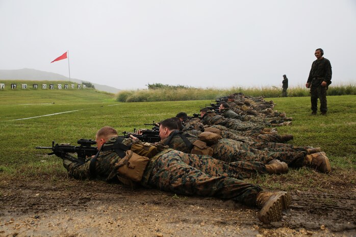 Reconnaissance Marines from 3rd Reconnaissance Battalion, 3rd Marine Division, lie in the prone position while conducting marksmanship training at Kaneohe Bay Range Training Facility, Feb. 4, 2014. (U.S. Marine Corps photo by Lance Cpl. Suzanna Knotts)