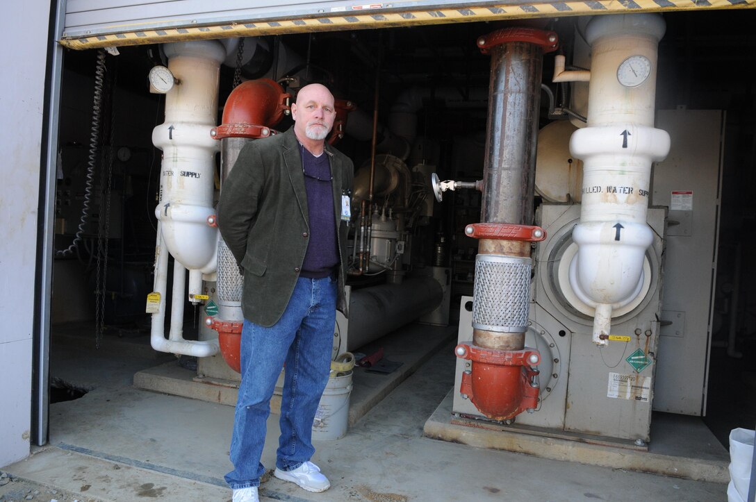 Jeff Boelman, head of Naval Health Clinic Quantico’s Facilities Department and the mainside clinic’s energy conservation officer, shows the building’s two massive air chillers on Friday. By shutting down most of the building’s climate control on weekends, including nine of the 11 air handlers and one of the chillers, while reducing the other chiller to 30 percent power, the facility was able to reduce its weekend energy consumption by more than 30 percent during the Power-Down Weekend pilot last summer. The clinic continues to save energy by reducing climate control on weekends.