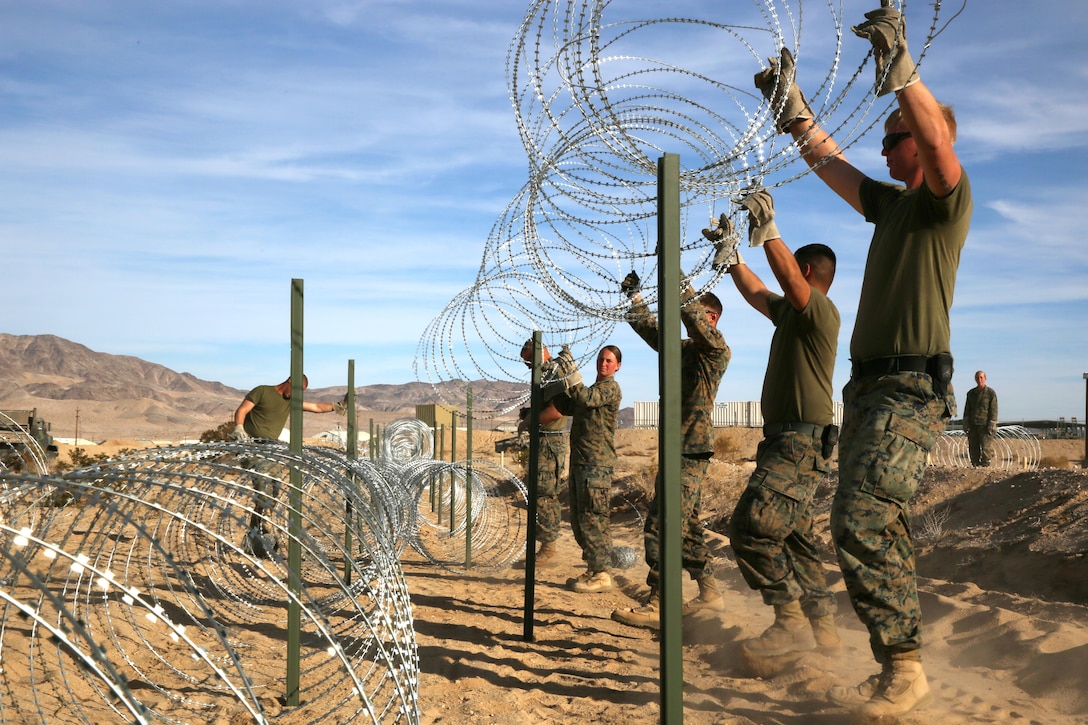 Marines with Marine Wing Support Squadron 374, keep watch from a tower at the Combat Center Expeditionary Air Field during the unit’s Integrated Training Exercise, Wednesday. The Marines learned how to effectively defend their air base by improving patrol and watch procedures.


