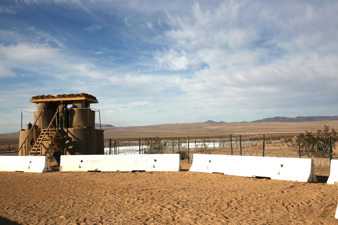 Marines with Marine Wing Support Squadron 374, keep watch from a tower at the Combat Center Expeditionary Air Field during the unit’s Integrated Training Exercise, Wednesday. The Marines learned how to effectively defend their air base by improving patrol and watch procedures.


