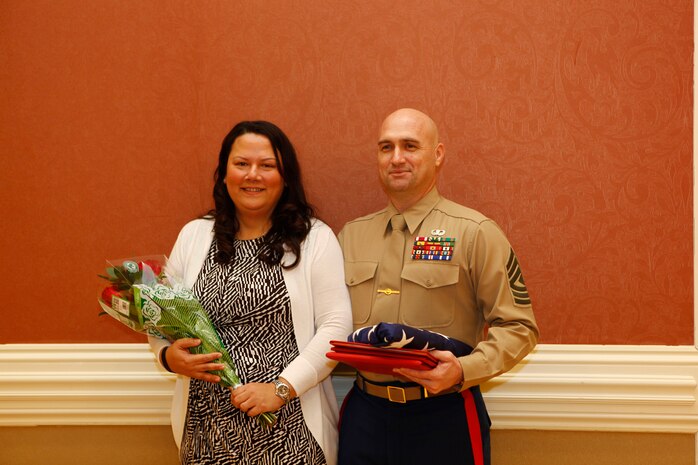 First Sergeant Kevin E. Hart poses for a photo with his wife Tamara during a retirement ceremony aboard Camp Lejeune, N.C., Feb. 7, 2014. 1st Sgt. Hart is the Company First Sergeant of Headquarters and Service Company, Combat Logistics Regiment 27, 2nd Marine Logistics Group. (U.S. Marine Corps photo by Lance Cpl. Desiré M. Mora)