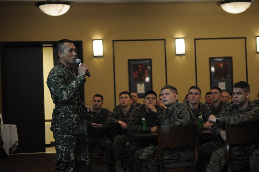 Second Lt. John Rubia tells the Marines of The Basic School’s Echo Company about the Philippians and the Filipino Marine Corps during the company’s International Officers Dinner on Jan. 14 at Lopez Hall. The dinner is a new tradition at TBS. 