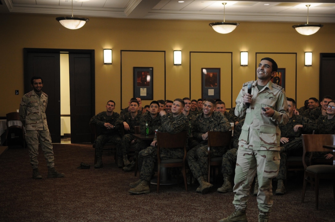 First Lt. Mohammed Alsubaie tells the Marines of The Basic School’s Echo Company about his home country of Saudi Arabia while his countryman, Capt. Mohammed Mushawwah, looks on during the company’s International Officers Dinner at Lopez Hall on Jan. 14. The dinner is a new tradition at TBS. 

