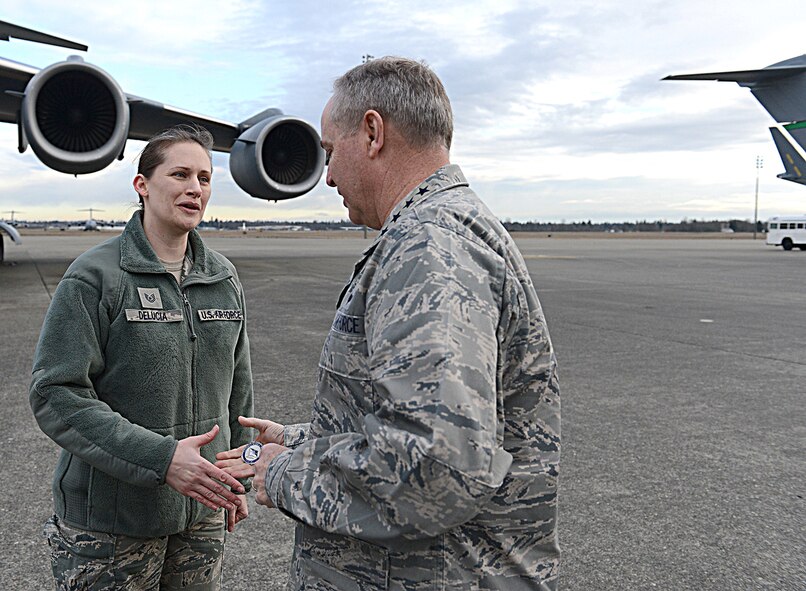Tech. Sgt. Jennifer DeLucia, 446th Airift Wing historian, receives a coin from Air Force Chief of Staff Gen. Mark A. Welsh III.,during his visit to Joint Base Lewis-McChord, Wash., Jan. 31-Feb. 4. (U.S. Air Force photo by Tech. Sgt. Sean Tobin)