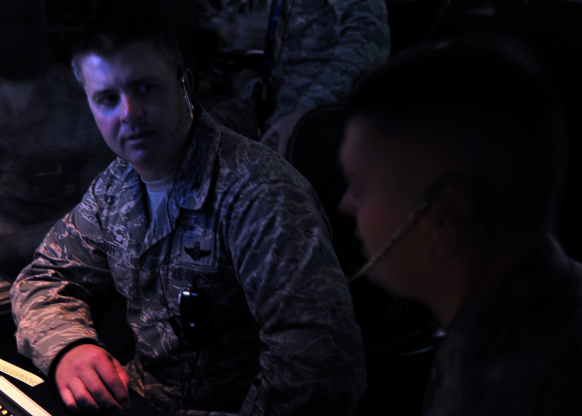 Col. David Graff, 325th Fighter Wing commander, talks with Staff Sgt. Justin Sprayberry 325th Operation Support Squadron air traffic controller radar approach control watch supervisor about his duties as an air traffic controller Feb. 7, at the RAPCON building. Graff shadows an Airman once a month as part of the Airman Shadow Program to see what it is like on a daily basis of an Airman. (U.S. Air Force photo by Airman 1st Class Sergio A. Gamboa)