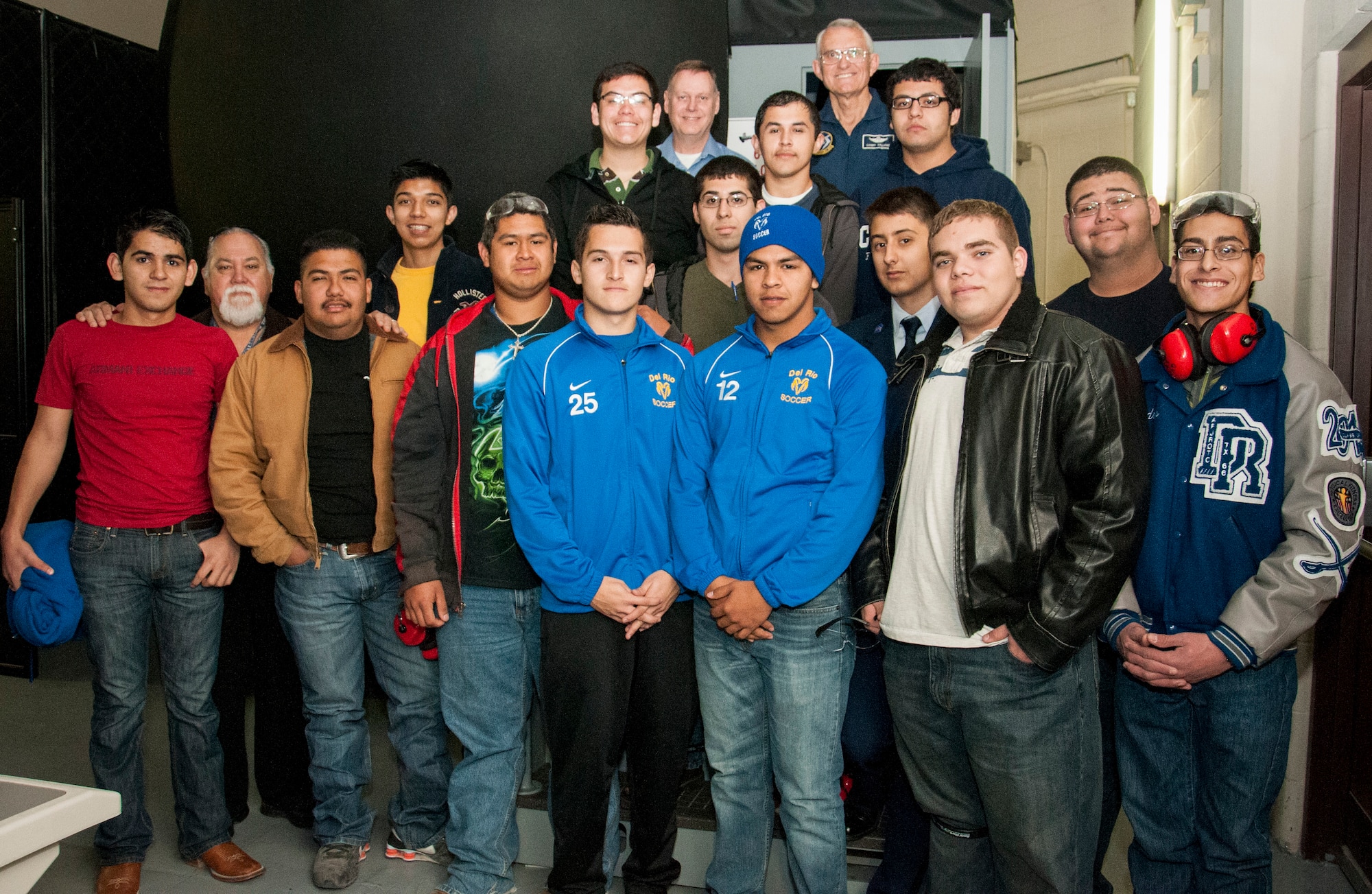 Del Rio High School Students from the Grow Your Own program pose for a photo with Laughlin personnel at Laughlin Air Force Base, Texas, Feb. 4, 2014. The students are juniors and seniors of the Del Rio High School Advance Technology class on the aircraft maintenance course. (U.S. Air Force photo/Airman 1st Class Ariel D. Delgado)
