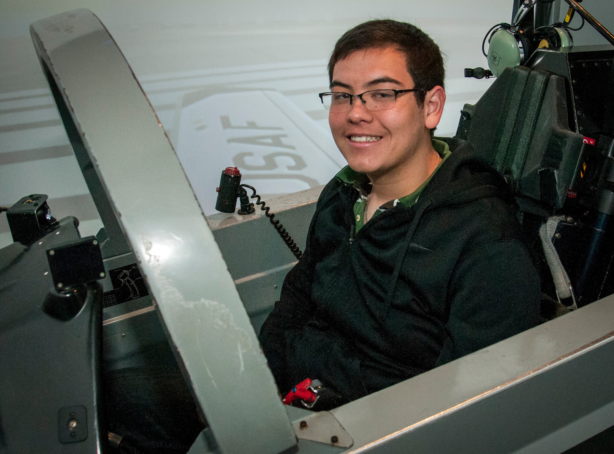 Joshua Sandoval, Del Rio High School and “Grow Your Own” student, poses for a photo on a T-6A Texan II Aircraft Simulator at Laughlin Air Force Base, Texas, Feb. 4, 2014. The program is an aviation technology program that gives the Del Rio High School students hands-on training on aircraft servicing and maintenance. (U.S. Air Force photo/Airman 1st Class Ariel D. Delgado