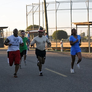 Joint Task Force-Bravo members participate in the 2014 Groundhog Day with 5k fun run/walk at Soto Cano Air Base, Honduras, Feb. 07, 2014. Top hats and Groundhog Day themed headpieces were handed out. The race was organized by the Army Support Activity's (ASA) Department of Family Morale Welfare and Recreation. (Photo by Ana Fonseca)  