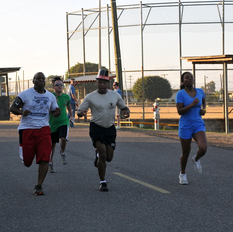 Joint Task Force-Bravo members participate in the 2014 Groundhog Day with 5k fun run/walk at Soto Cano Air Base, Honduras, Feb. 07, 2014. Top hats and Groundhog Day themed headpieces were handed out. The race was organized by the Army Support Activity's (ASA) Department of Family Morale Welfare and Recreation. (Photo by Ana Fonseca)  