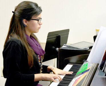 Photo by Lori Newman
Veronica Soto, 15, plays the piano during the Musical Moments Holiday Recital Dec. 16 at the Gift Chapel. The Musical Moments program is one of several activities the Exceptional Family Member Program offers families throughout the year.