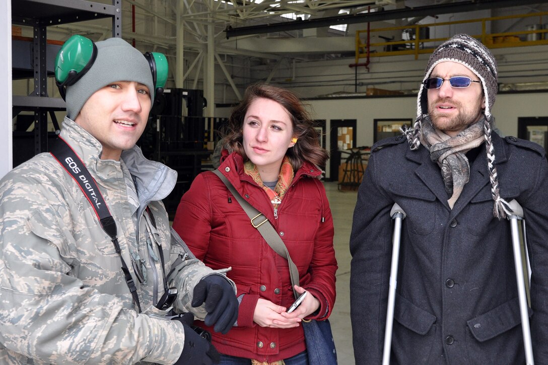 YOUNGSTOWN AIR RESERVE STATION, Ohio - U.S. Air Force Reserve Tech. Sgt.  Joshua Shaffer, an air terminal operations specialist assigned to the 910th Airlift Wing’s 76th Aerial Port Squadron (APS), talks with representatives from MedWish International on the flight line outside of the APS hangar here, Feb. 1, 2014. Citizen Airmen from the 76th APS palletized and loaded humanitarian cargo, collected by MedWish, onto a C-17 Globemaster cargo aircraft at YARS. The cargo was bound for Honduras and was transported through the Denton program which allows non-governmental agencies to use military airlift for humanitarian purposes. U.S. Air Force photo by Master Sgt. Bob Barko Jr.