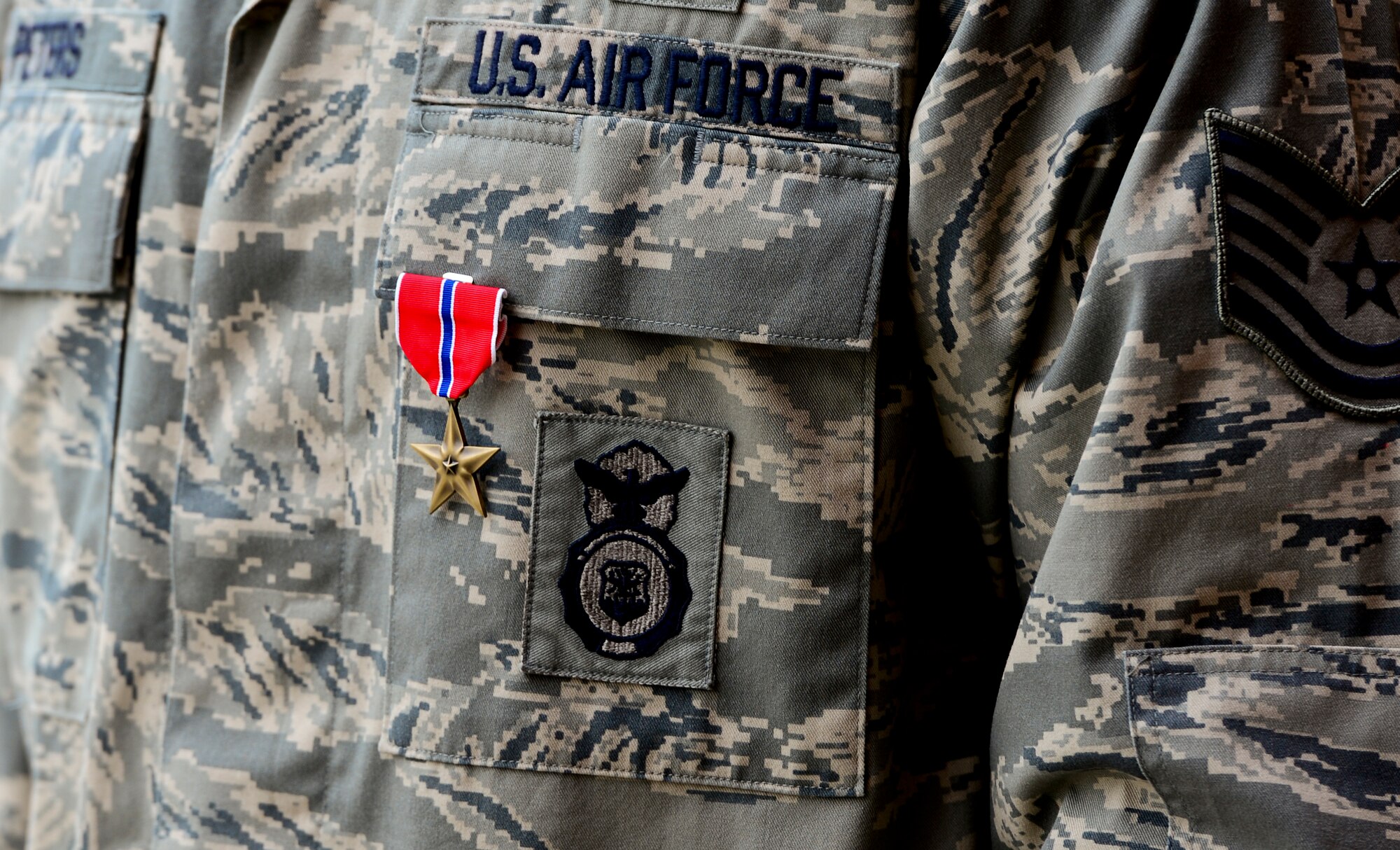 Tech. Sgt. Andre Peters, 6th Security Forces Squadron military working dog NCO in-charge, was awarded a bronze star medal, in August 2013 for his six-month deployment supporting Operation Enduring Freedom. As the Regional Command-West military and contract working dog program manager, he was credited with the removal of 212 pounds of homemade explosives, nine improvised explosive devices, eight heavy assault weapons, 2,500 rounds of ammunition, and $4.7 million worth of narcotics, used to fund terrorist combat operations. (U.S. Air Force photo by Senior Airman Melanie Bulow-Gonterman/Released)