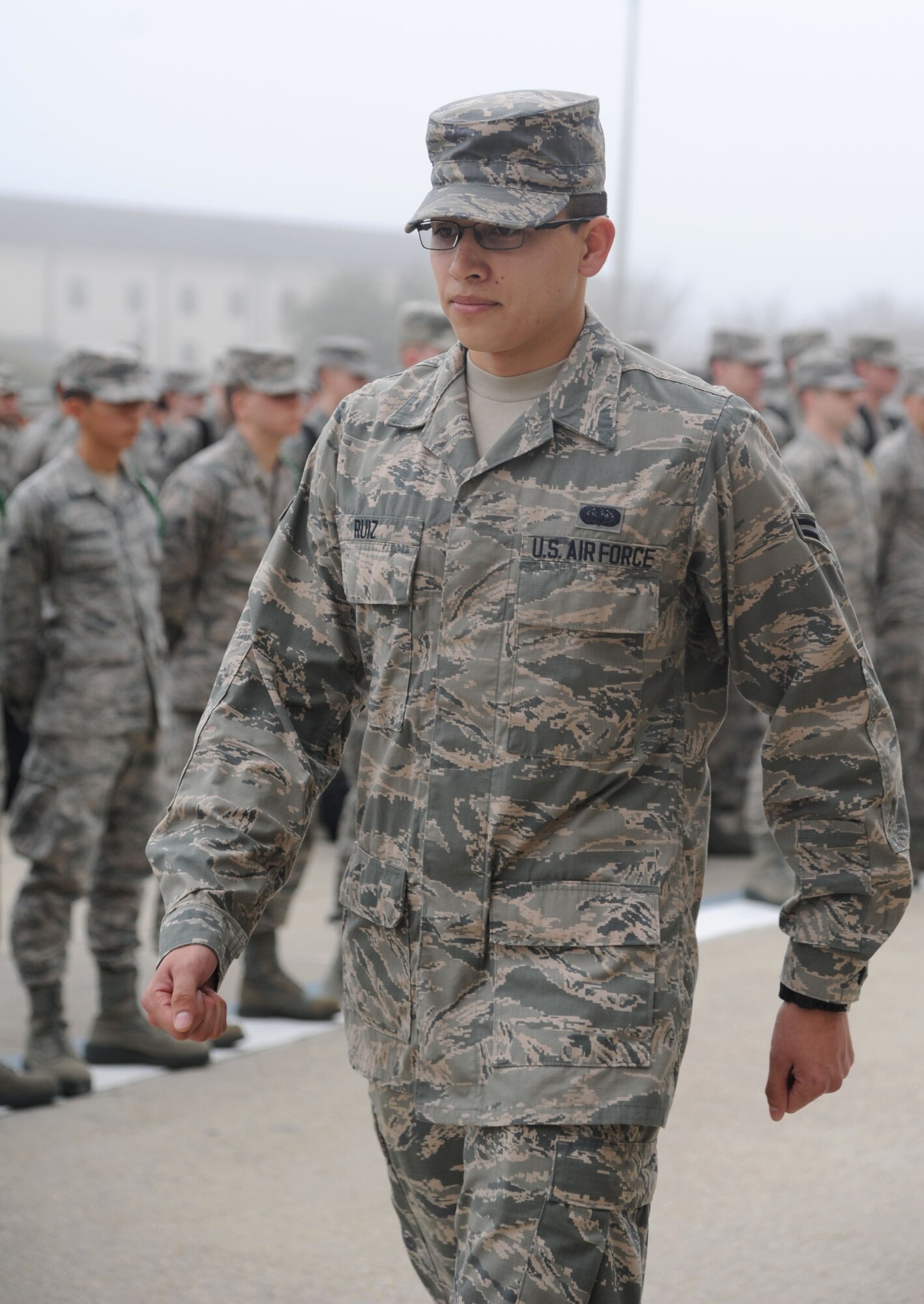 Airman First Class Javier Ruiz, 336th Training Squadron, marches in front of Airmen Feb. 4, 2014, at the Levitow Training Support Facility, Keesler Air Force Base, Miss.  He is the 81st Training Group’s Airman of the Month for January.  Ruiz, from Ludington, Mich., is currently training in the cyber surety apprentice course.  The four squadrons that train nonprior service students each select one Airman to compete at a monthly group board. The Airmen respond to questions about customs and courtesies, dress and appearance, enlisted force development and current events from that week’s issue of the Keesler News.  (U.S. Air Force photo by Kemberly Groue)