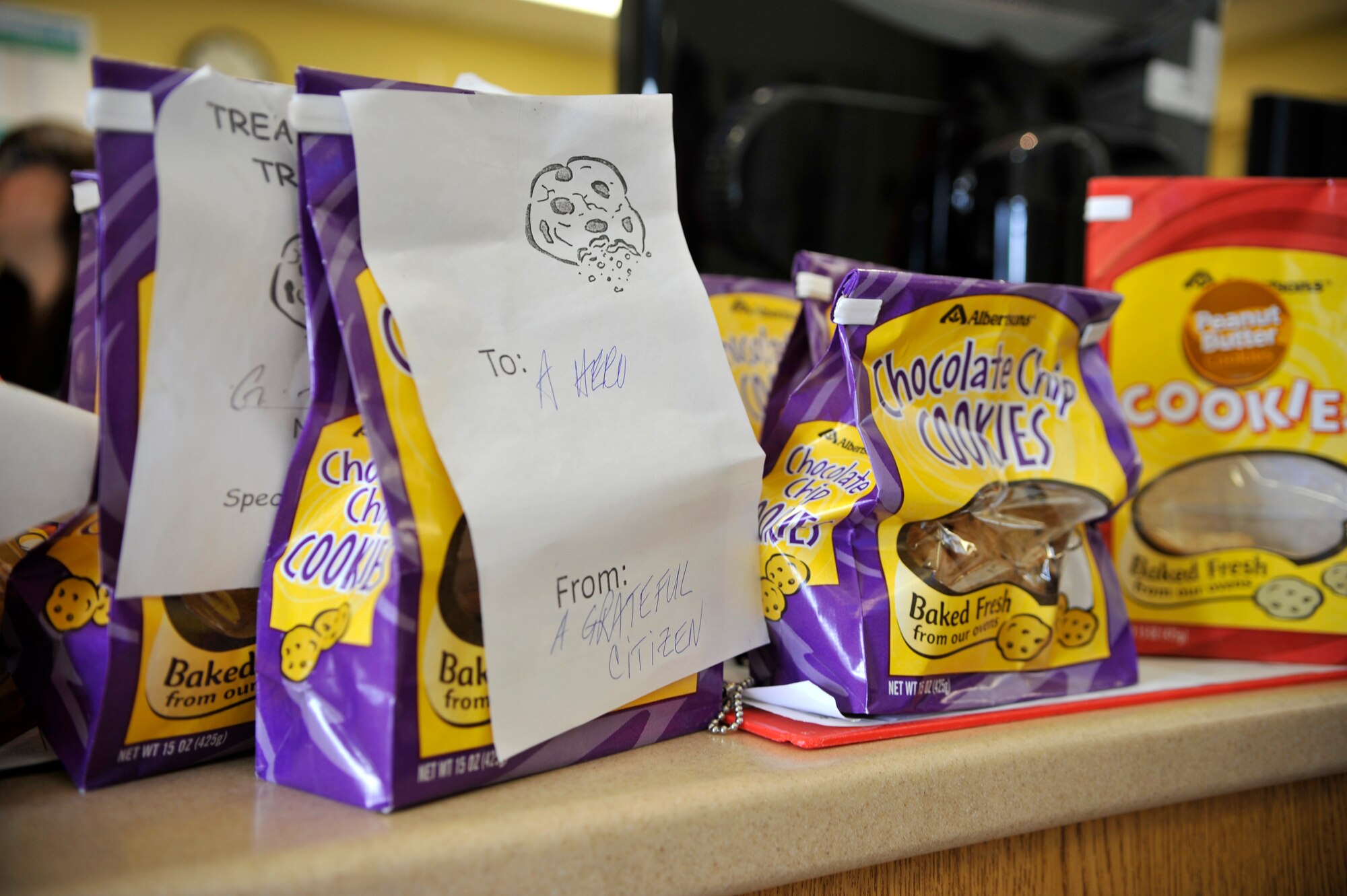 The Airmen of Vandenberg were once again gifted cookies from the Lompoc and surrounding areas Albertsons in what is dubbed the second annual Operation Cookie Wagon. Albertsons donated 1,900 dozen cookies to the Child Development Center, Crestview Elementary, Vandenberg Middle School and the 381st Training Group non-prior service Airmen, delivered Feb. 7, in honor of Valentine’s Day. (U.S. Air Force photo/Michael Peterson)
