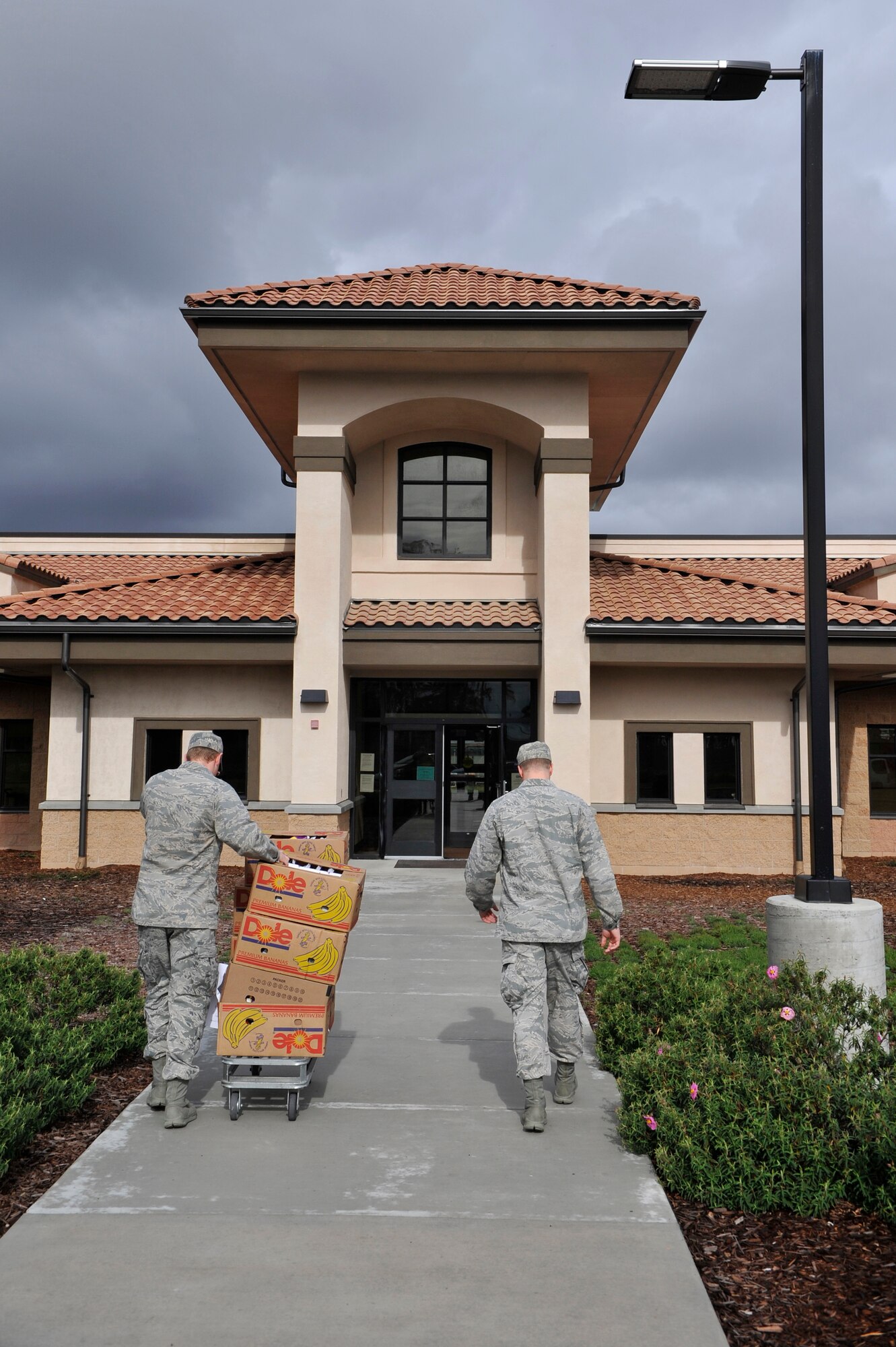 Two Vandenberg Airmen take dontated cookies to the Child Development Center here, Feb. 7. The Airmen of Vandenberg were once again gifted cookies from the Lompoc and surrounding areas Albertsons in what is dubbed the second annual Operation Cookie Wagon. Albertsons donated 1,900 dozen cookies to the Child Development Center, Crestview Elementary, Vandenberg Middle School and the 381st Training Group non-prior service Airmen, delivered Feb. 7, in honor of Valentine’s Day.(U.S. Air Force photo/Michael Peterson)