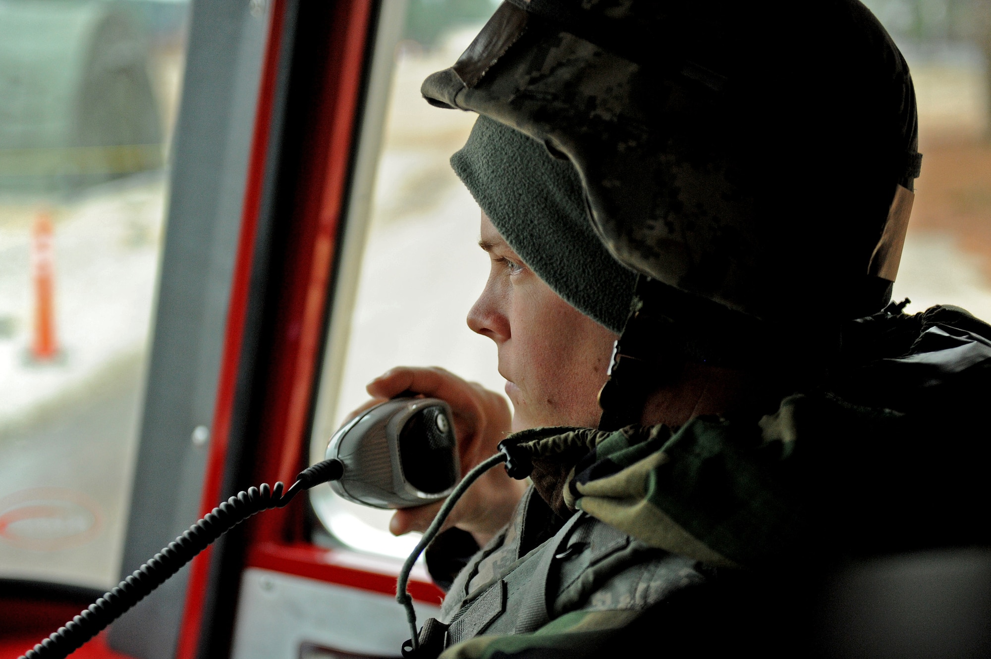 Staff Sgt. Jeremy Luedtke, 4th Civil Engineering Squadron firefighter, communicates with dispatch during Employment Exercise Coronet Warrior 14-01, Feb. 4, 2014, at Seymour Johnson Air Force Base, N.C. During the exercise firefighters responded to several simulated emergencies. (U.S. Air Force photo by Airman 1st Class Aaron J. Jenne)