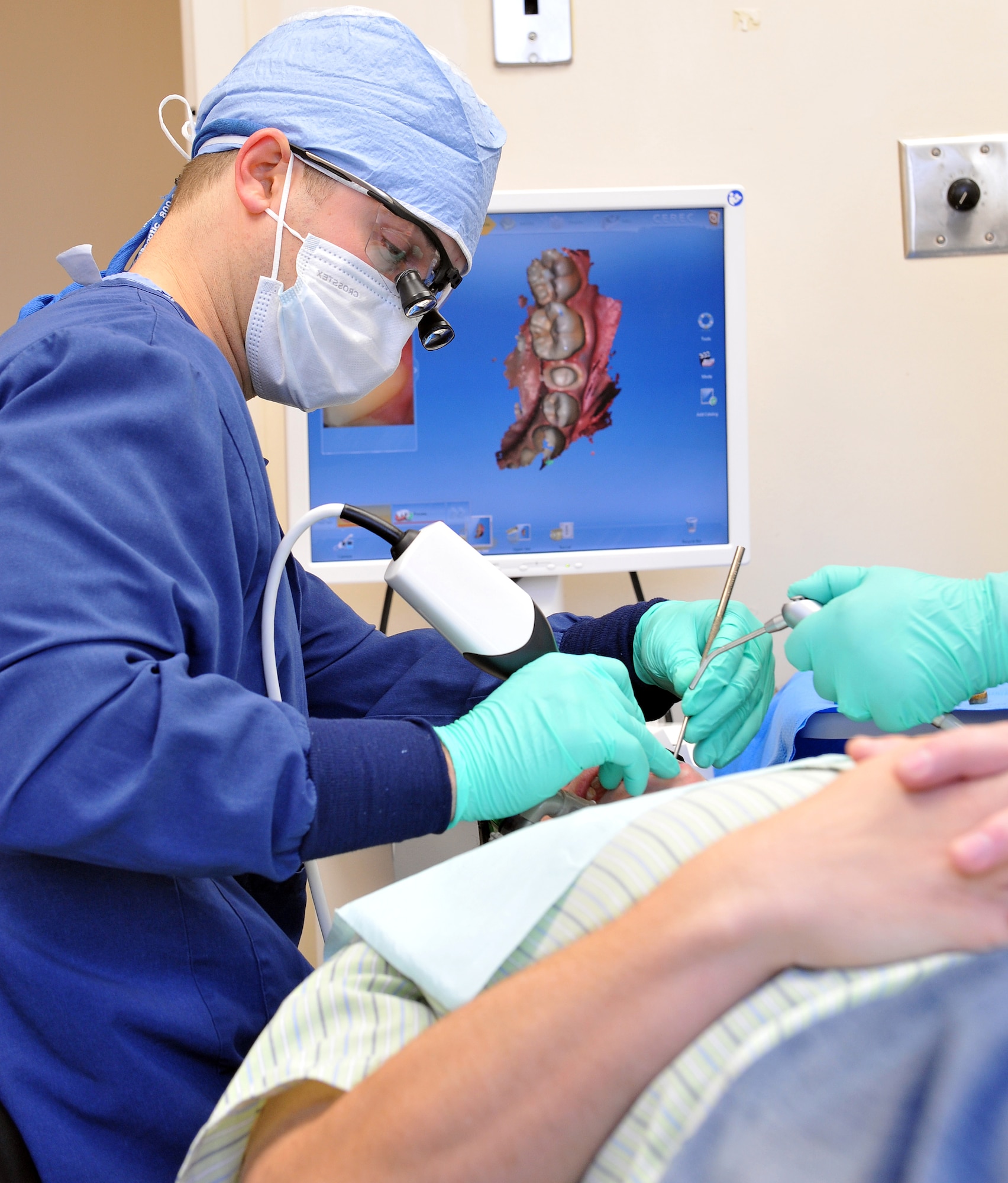 Capt. Ben Areheart, 78th Dental Squadron, dentist, uses a digital scanner to produce a three dimensional image of a patient’s teeth and soft tissue structures. (U.S. Air Force photo by Tommie Horton)