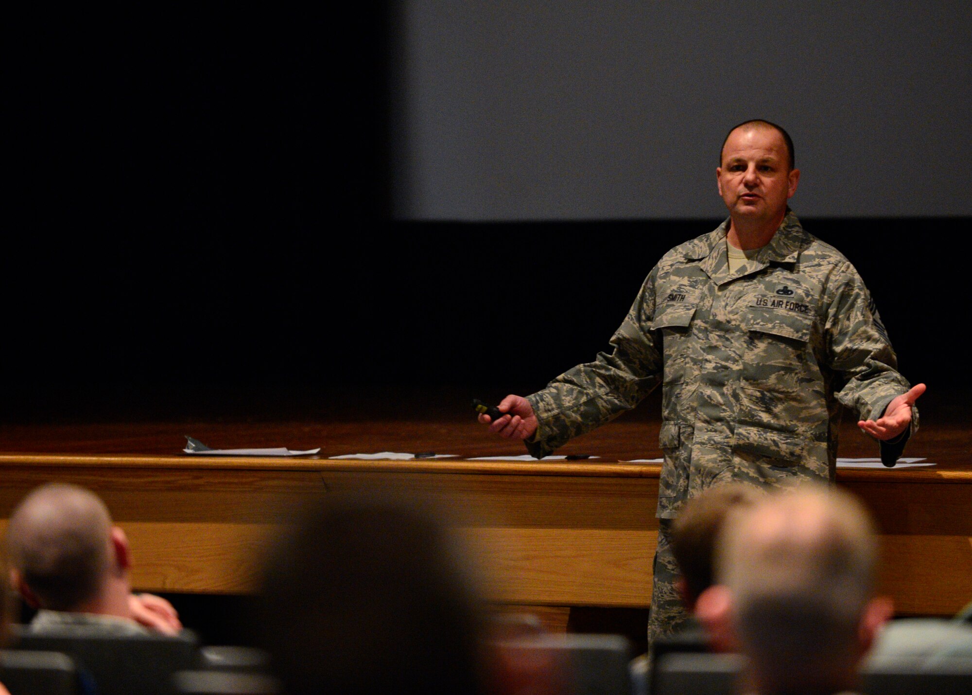 Chief Master Sgt. James Smith, 436th Airlift Wing command chief, holds an all-call for Airmen motorcycle riders Jan. 31, 2014, at the base theater on Dover Air Force Base, Del. Smith briefed on recent motorcycle mishaps that hit Dover AFB and wanted to ensure that a safe riding culture is being practiced. (U.S. Air Force photo/Airman 1st Class William Johnson)