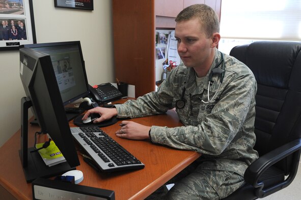 Capt. Trevor Peterson, 341st Medical Operations Squadron Family Health Clinic staff physician, reviews messages in the Air Force Medical Service MiCare system at the Malmstrom Air Force Base Clinic on Jan. 28. Peterson replies to approximately 10 messages from patients on a daily basis. (U.S. Air Force photo/Senior Airman Katrina Heikkinen)