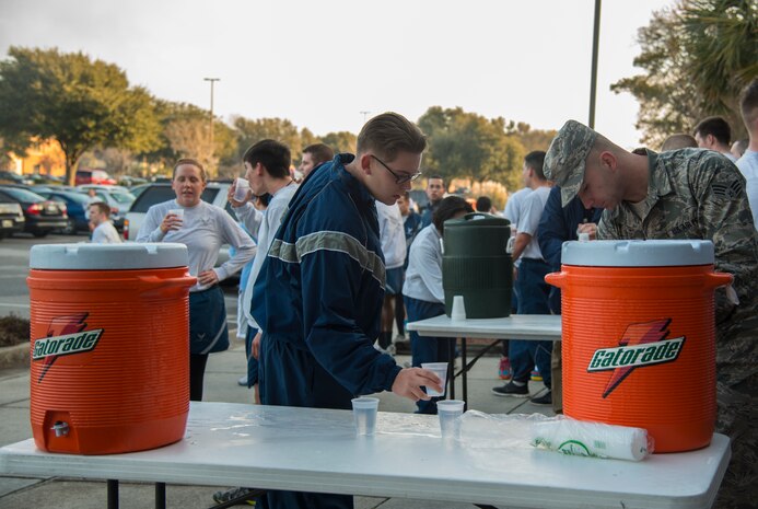 Members of Joint Base Charleston cool down after running the Commander’s Challenge 5K Run Feb. 7, 2014 on Joint Base Charleston – Air Base, S.C. The Commander’s Challenge is held monthly to test Team Charleston’s fitness abilities. (U.S. Air Force photo/ Airman 1st Class Clayton Cupit)