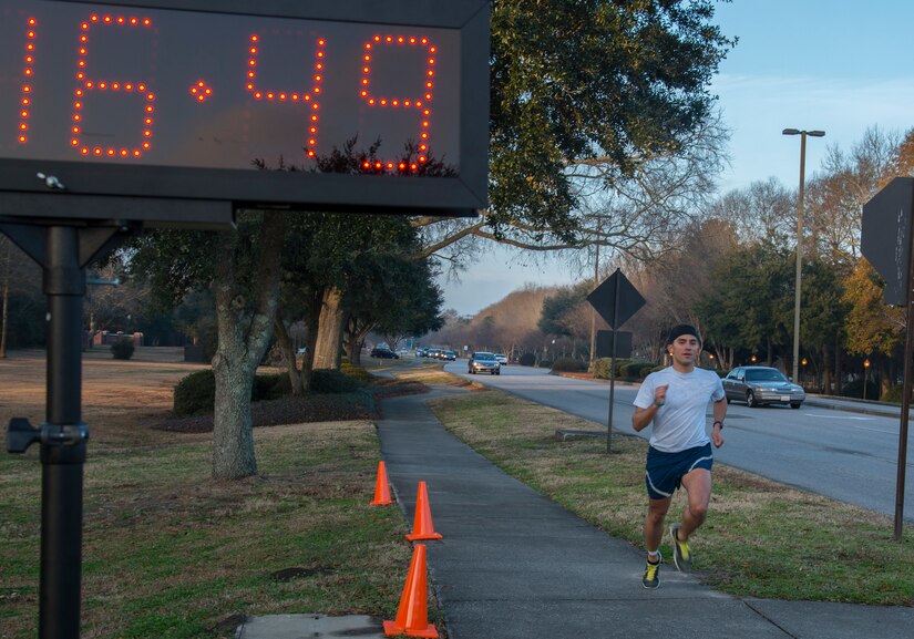 2nd Lt. John Montes, 628th Logistics Readiness Squadron, sprints to the finish line during the Commander’s Challenge 5K Run Feb. 7, 2014, on Joint Base Charleston – Air Base, S.C. The Commander’s Challenge is held monthly to test Team Charleston’s fitness abilities. Montes was the top male runner with a time of 16:51. (U.S. Air Force photo/ Airman 1st Class Clayton Cupit)