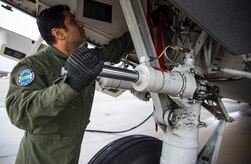 Warrant Officer Bavvr Al-Duwaisan, Kuwait Air Force’s 41st Transport Squadron loadmaster, performs initial checks prior to take-off Feb. 5, 2014, on a C-17 Globemaster III at Joint Base Charleston – Air Base, S.C. The Kuwait Air Force recently purchased a second C-17 and 17th AS Airmen were to familiarize the Kuwait flight crew on the operations and maintenance of the C-17. (U.S. Air Force photo/ Airman 1st Class Clayton Cupit)
