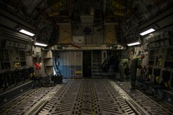 Warrant Officer Bavvr Al-Duwaisan (left), Kuwait Air Force’s 41st Transport Squadron loadmaster, and Tech. Sgt. Joe York, 17th Airlift Squadron noncommissioned officer in charge in charge of standards and evaluations, prepare their equipment prior to take-off Feb. 5, 2014, on a C-17 Globemaster III at Joint Base Charleston – Air Base, S.C. The Kuwait Air Force recently purchased a second C-17 and 17th AS Airmen were to familiarize the Kuwait flight crew on the operations and maintenance of the C-17. (U.S. Air Force photo/ Airman 1st Class Clayton Cupit)