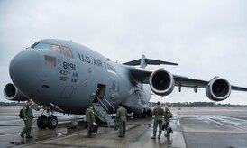 Both the Kuwait and American flight crews prepare to board a C-17 Globemaster III Feb. 5, 2014, on the flight line at Joint Base Charleston – Air Base, S.C. The Kuwait Air Force recently purchased a second C-17 and 17th AS Airmen were to familiarize the Kuwait flight crew on the operations and maintenance of the C-17. (U.S. Air Force photo/ Airman 1st Class Clayton Cupit)
