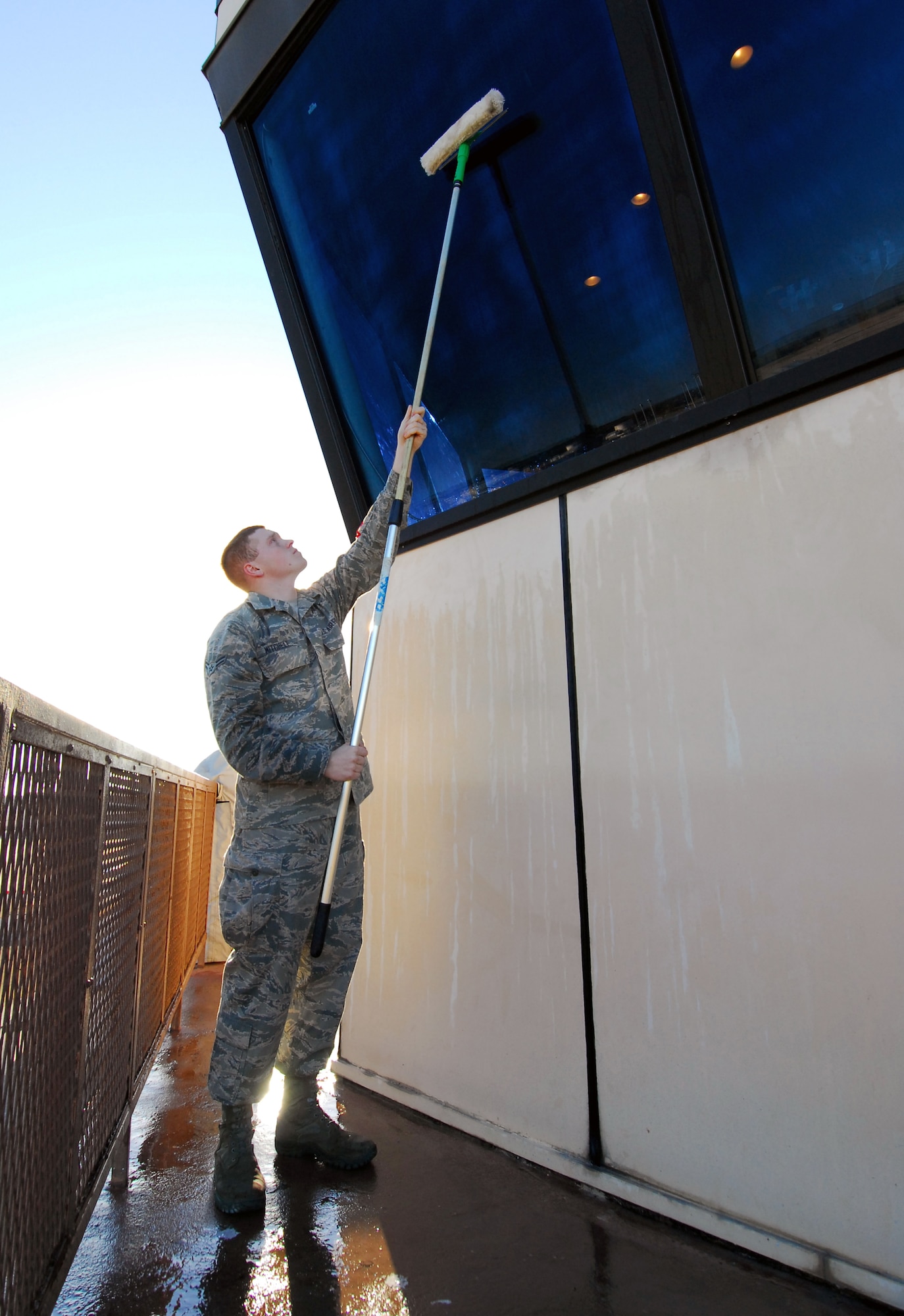 Sometimes a seemingly trivial task makes the mission become crystal clear.

Airmen in the 78th Operations Support Squadron are responsible for keeping the windows clean at the top of the base’s air traffic control tower. 

It’s imperative to provide a clear field of view for the controllers who direct the aircraft which take off and land here.

Once a week, two Airmen walk onto a catwalk outside the tower and use a garden hose and an extended window washing tool similar to a common household squeegee to clean the windows. 

Airman 1st Class Ryan Mitchell, air traffic control apprentice, performs window-washing duties. (U.S. Air Force photo by Ed Aspera)