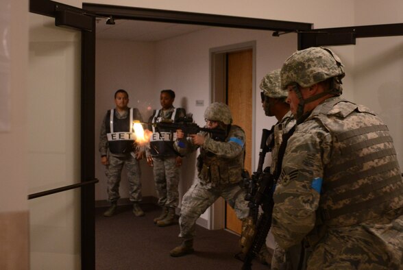 9th Security Forces members respond to an active shooter exercise at Beale Air Force Base, Calif., Feb. 5, 2014. Security Forces members utilized blank rounds to create a sense of realism. (U.S. Air Force photo by Tech. Sgt. Ricky Bloom/Released)