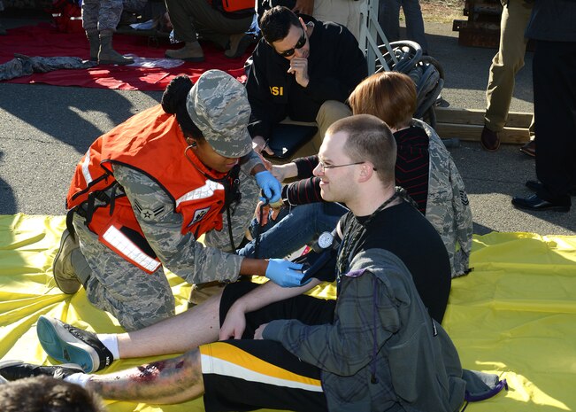 Beale medical staff tend to simulated victims during an active shooter exercise at Beale Air Force Base, Calif., Feb. 5, 2014. Simulated victims were added to the scenario to create more of a sense of realism. (U.S. Air Force photo by John Schwab/Released)