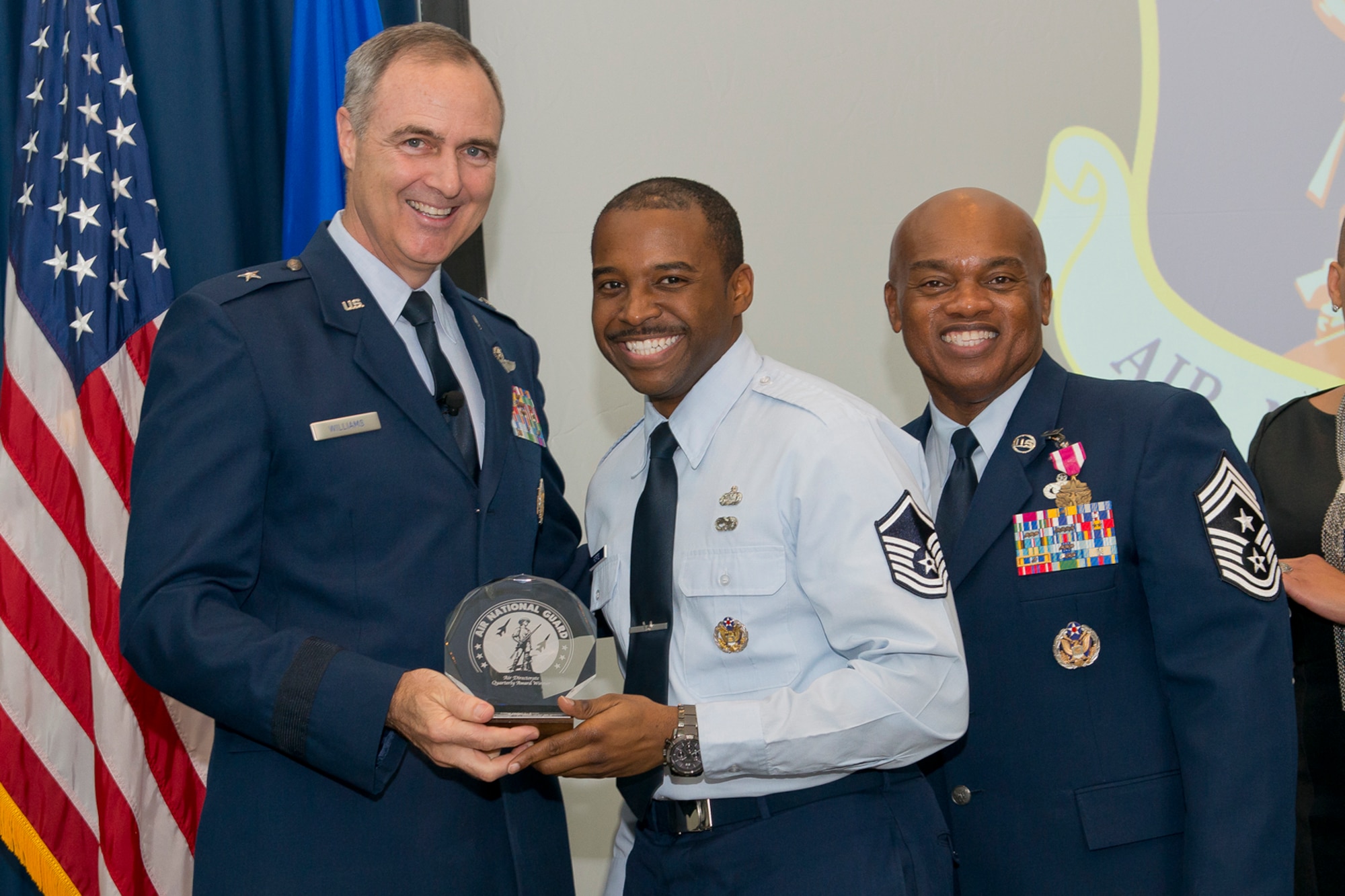 Brig. Gen. R. Scott Williams, the commander of the Air National Guard Readiness Center, and Chief Master Sgt. Tony L. Whitehead, the command chief master sergeant of the ANGRC, present the Senior Non-Commissioned Officer of the Quarter to Master Sgt. Jamel L. Forte, ANGRC Logistics, during the ANGRC 4th Quarter Awards Ceremony and Commander’s Call Feb. 6, 2014, at the ANGRC, Joint Base Andrews, Md. The ceremony hosted by Williams recognizes the accomplishments of the ANGRC staff. (U.S. Air National Guard photo by Master Sgt. Marvin R. Preston/RELEASED)