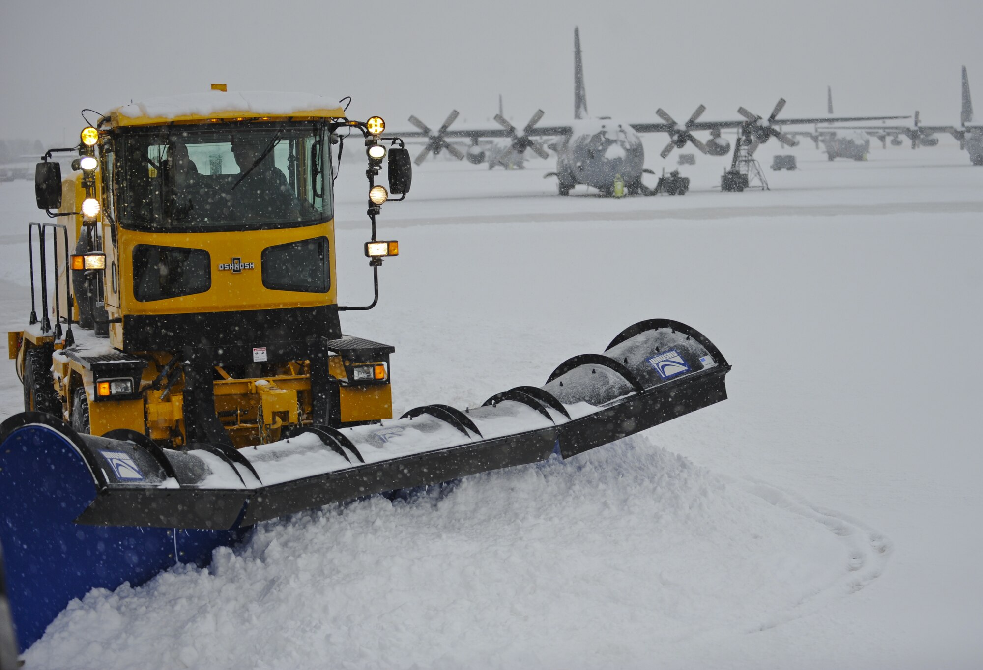 PETERSON AIR FORCE BASE, Colo. -- One of three snow plows from the 21st Civil Engineer Squadron sits on the flightline Feb. 4. The 21st Operations Support Squadron will call the 21st CES to clear the flightline depending on the operations for the day. (U.S. Air Force photo/Staff Sgt. Jacob Morgan)