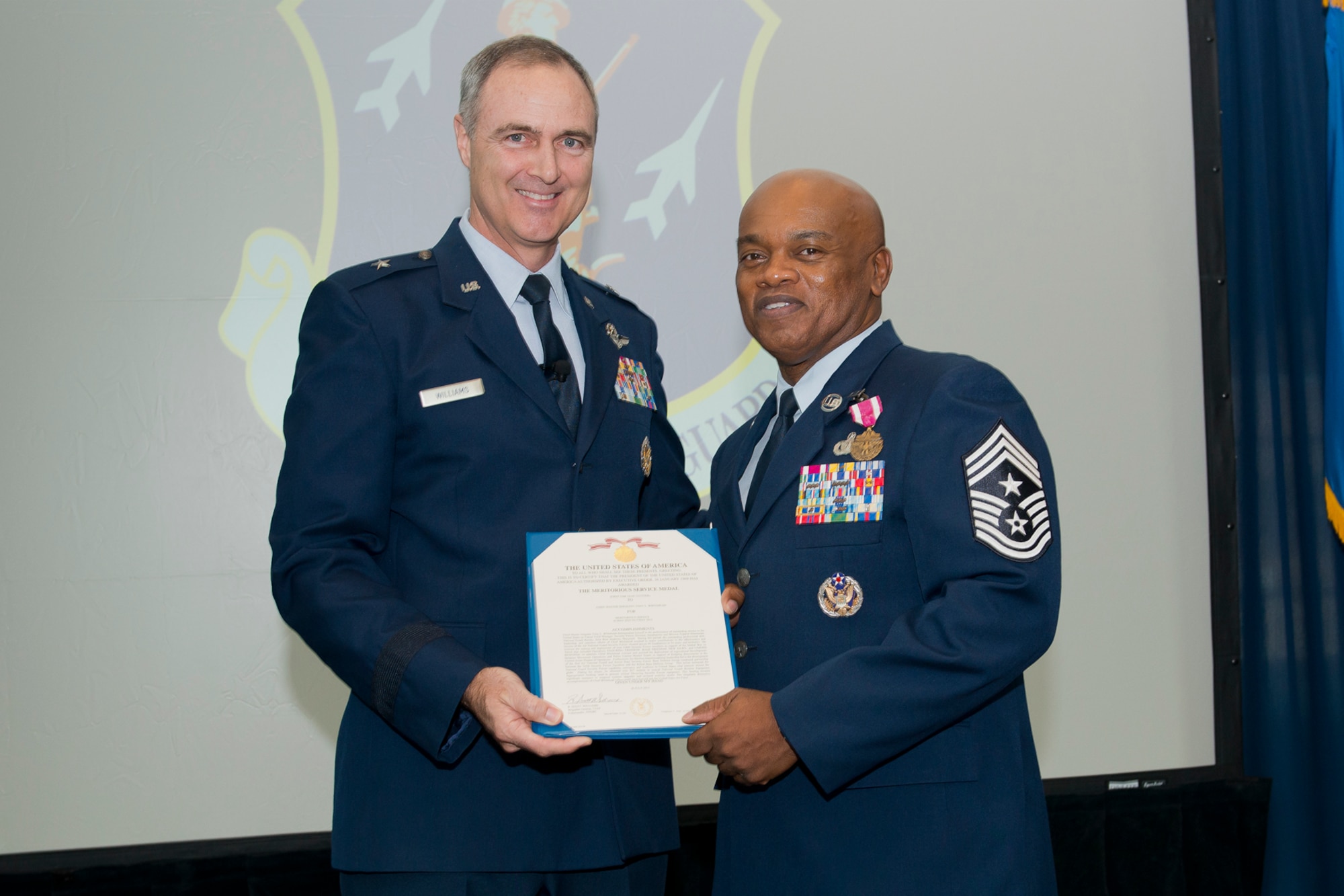 Brig. Gen. R. Scott Williams, the commander of the Air National Guard Readiness Center, presents the Meritorious Service Medal, first Oak Leaf Cluster, to Chief Master Sgt. Tony L. Whitehead, the command chief master sergeant of the ANGRC, during the ANGRC 4th Quarter Awards Ceremony and Commander’s Call Feb. 6, 2014, at the ANGRC, Joint Base Andrews, Md. Whitehead received the MSM, first Oak Leaf Cluster, for his work as the Air National Guard Security Forces Division Career Field Manager from May 16, 2010, to May 5, 2013, where his accomplishments included oversight and deployment of more than 4,800 Security Forces members in support various combat operations around the world.