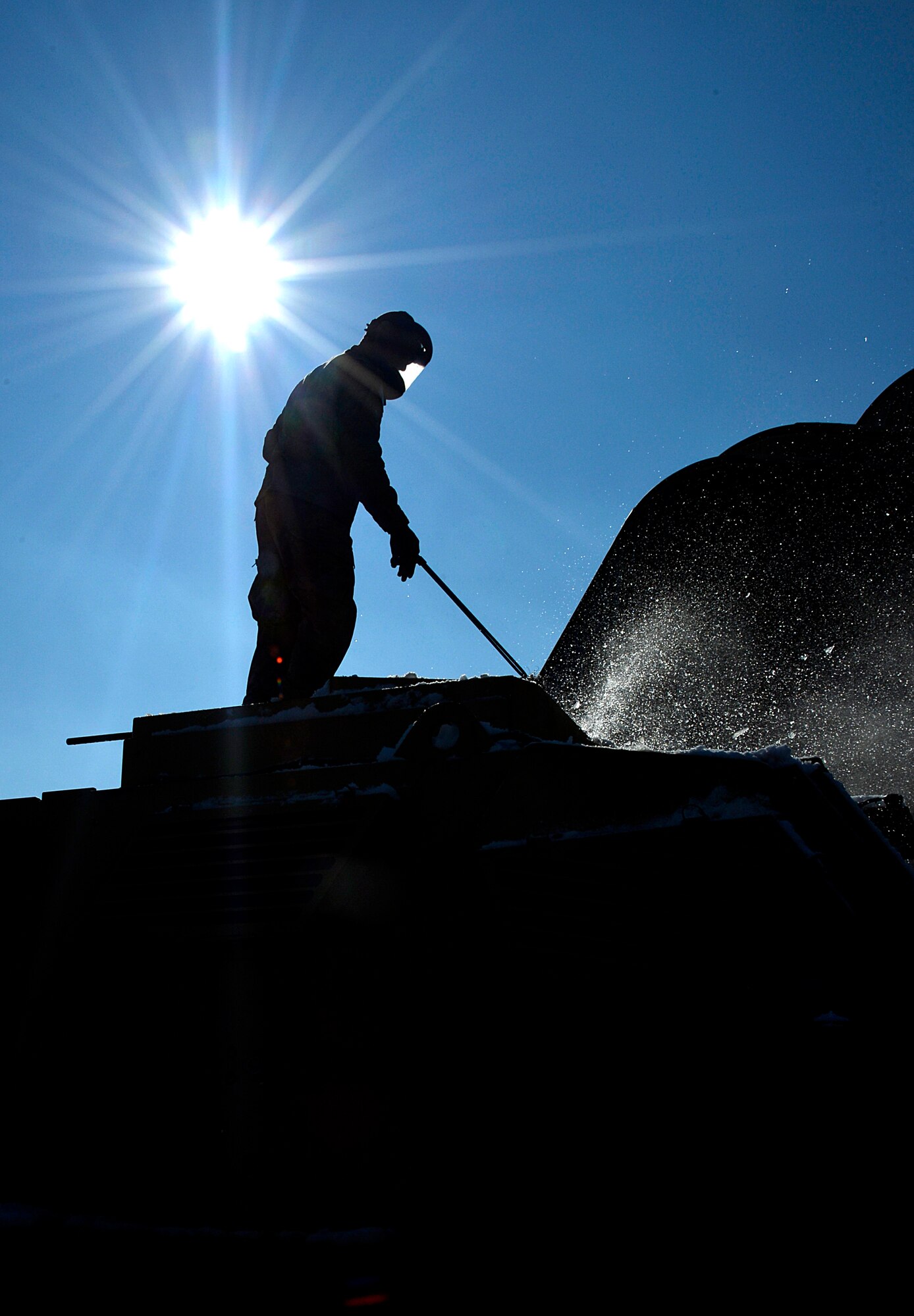 U.S. Air Force Airman 1st Class Anthony Wright, 455th Expeditionary Logistics Readiness Squadron, to pressure washes a Mine-Resistant Ambush Protection vehicle at Bagram Airfield, Afghanistan, Feb. 7, 2014. MRAPs must be washed and have maintenance done before they can be shipped out of Bagram. (U.S. Air Force photo by Senior Airman Kayla Newman/Released)