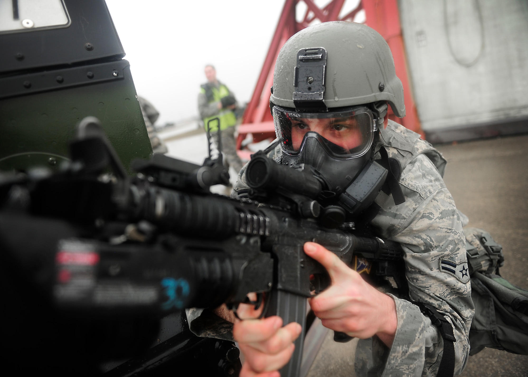A 31st Security Forces Squadron Airman, defends their post during a wing inspection, Feb. 4, 2014, at Aviano Air Base, Italy. Emergency responders participated in several simulated scenarios during a week-long inspection, which tested the wing’s ability to
respond to emergency situations.  (U.S. Air Force Photo/ Staff Sgt. Evelyn Chavez)