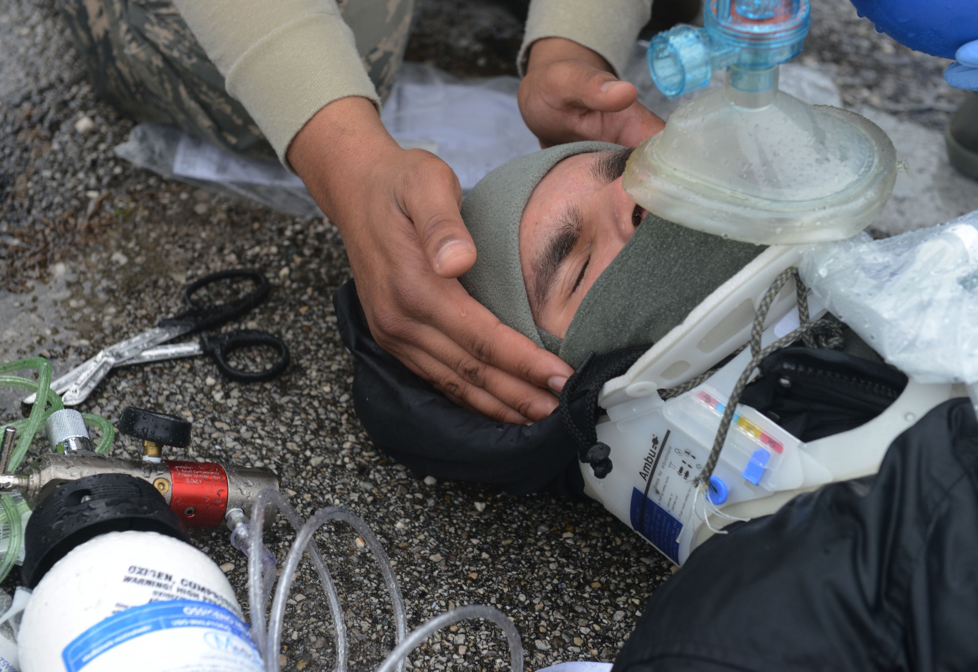An individual is treated for simulated injuries during a wing inspection, Feb. 3, 2014, at Aviano Air Base, Italy.  Emergency responders participated in simulated scenarios during a week-long inspection, which tested the wing’s ability to respond to emergency situations.  (U.S. Air Force photo/Airman 1st Class Ryan Conroy)