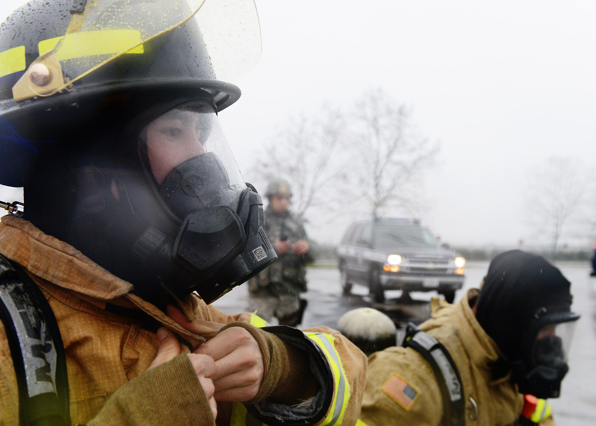 A 31st Civil Engineer Squadron firefighter, adjusts his gear during a wing inspection, Feb. 3, 2014, at Aviano Air Base, Italy. Emergency responders participated in simulated scenarios during a week-long inspection, which tested the wing’s ability to respond to emergency situations.  (U.S. Air Force photo/Airman 1st Class Ryan Conroy)