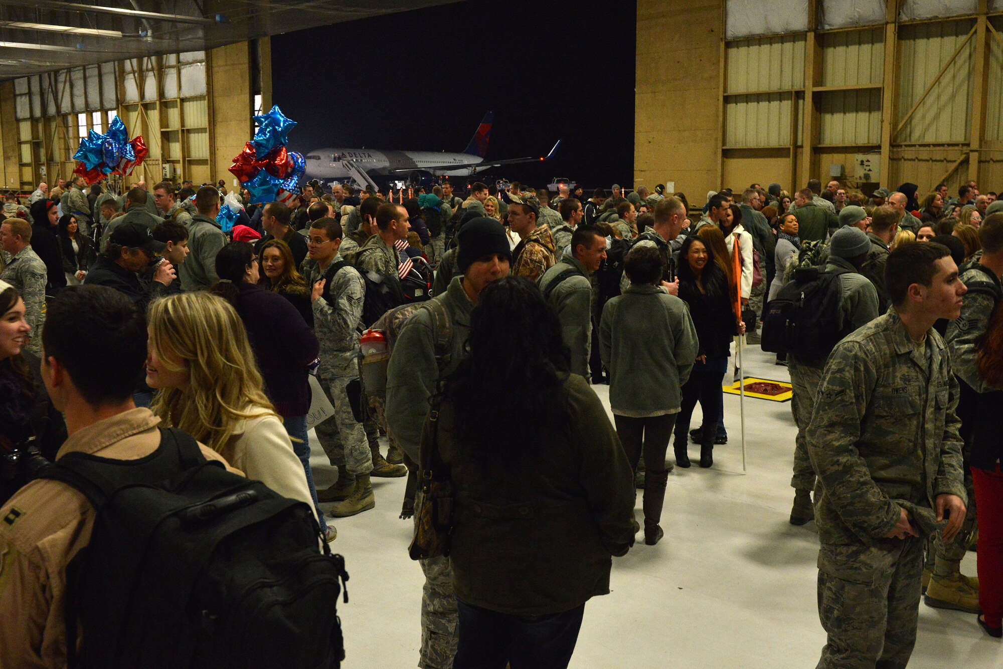 U.S. Air Force Airmen assigned to the 20th Fighter Wing, spend time with family and friends after returning from a deployment, Shaw Air Force Base, S.C., Feb. 7, 2014. Approximately 200 Shaw Airmen were welcomed home after being deployed for five months to U.S. Central Command’s Area of Responsibility. (U.S. Air Force photo by Airman 1st Class Jensen Stidham/Released)